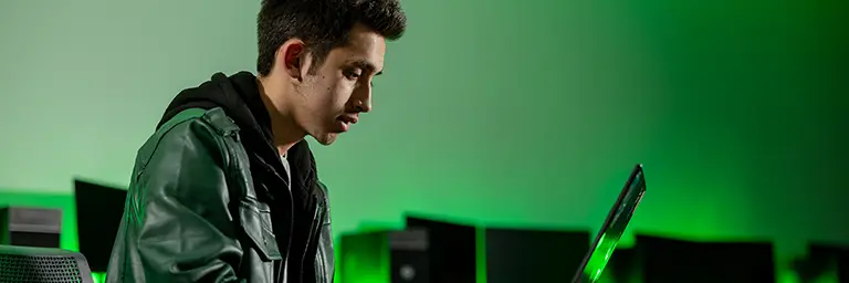 student working on laptop in computer lab