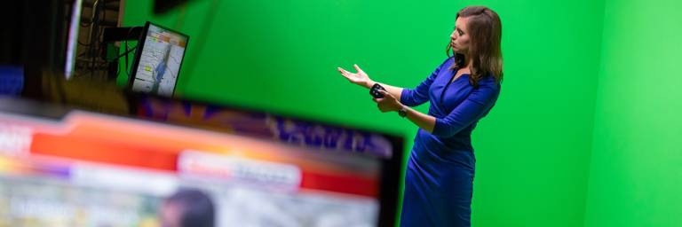 Digital Media Production student in front of TV camera