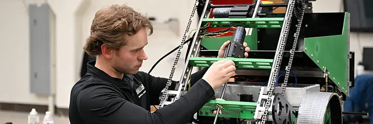 UND Mechanical Engineering Student with Equipment