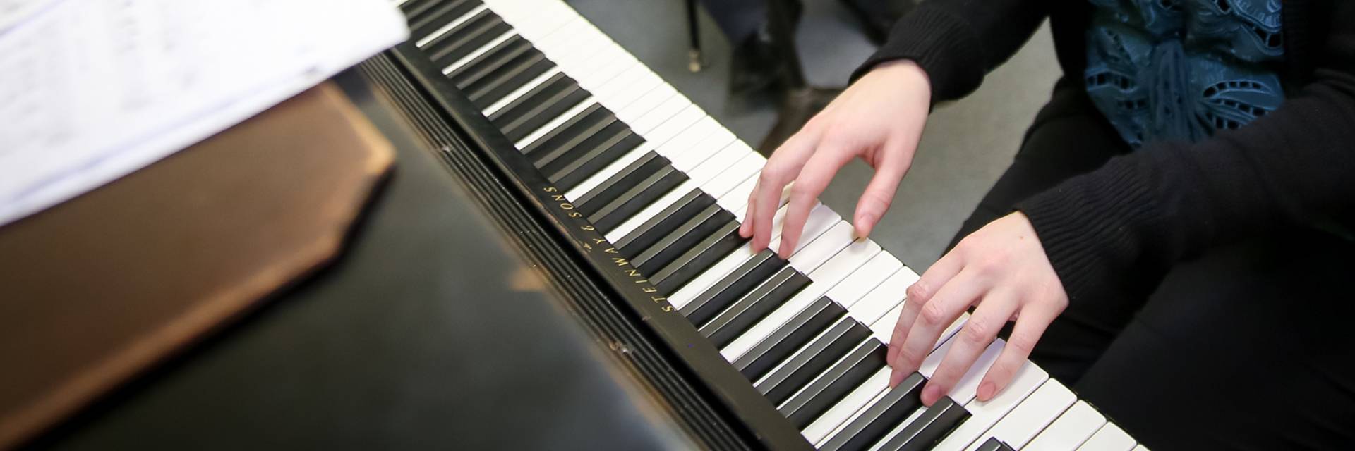 music student playing piano