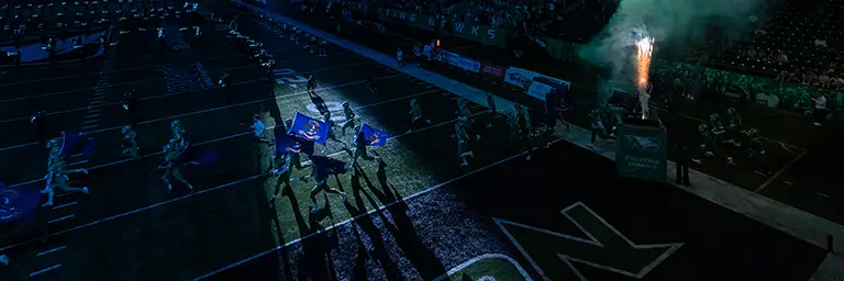 football players running on field