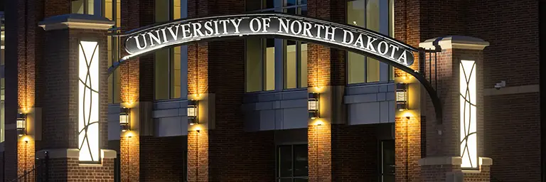 a view of UND campus arch at night