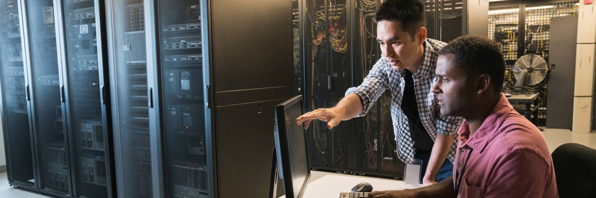 two people working in computer center