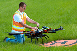 working on drone in field