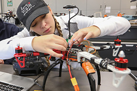 student working on electronics