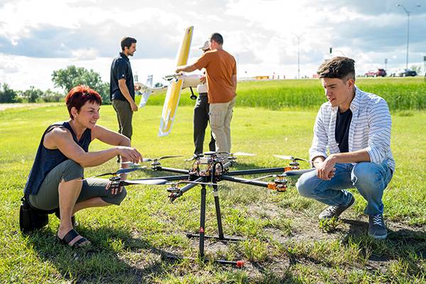 faculty and professor examining plane