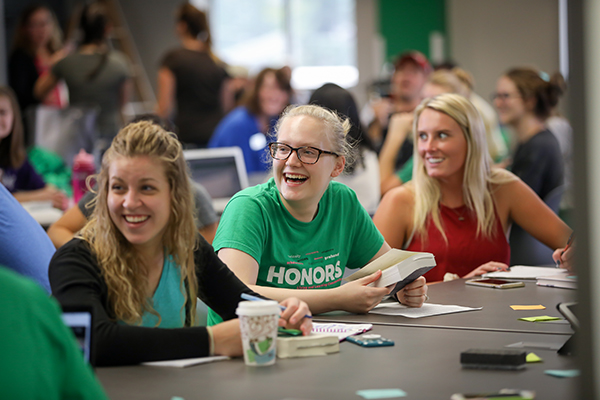 students discussing finances with advisor