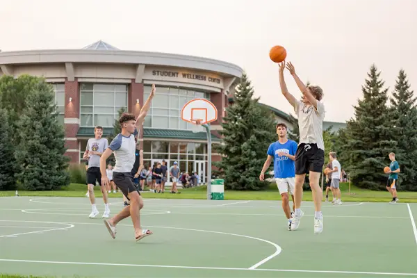 UND Students Playing Basketball Outside of Wellness Center