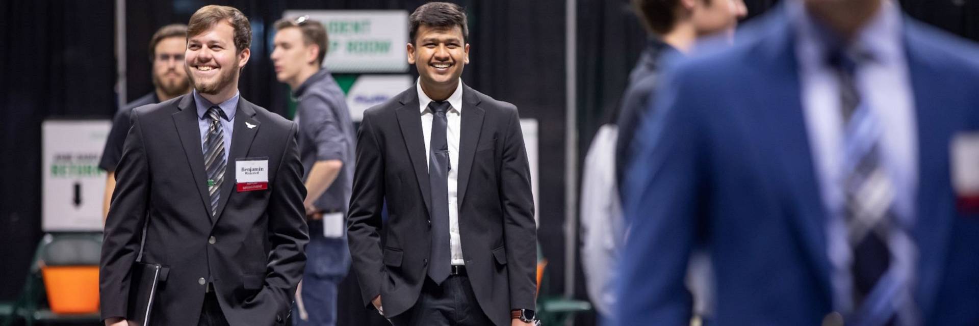 students and employers gather at a career fair