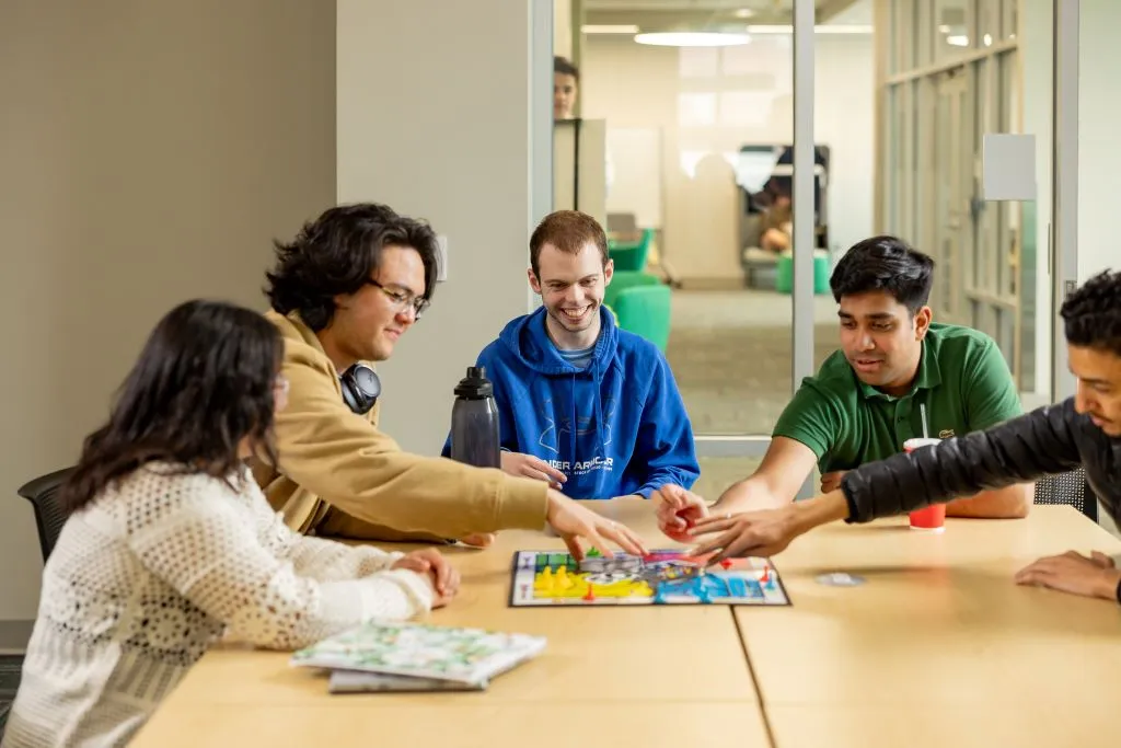 Students playing board games in The Hilyard Center