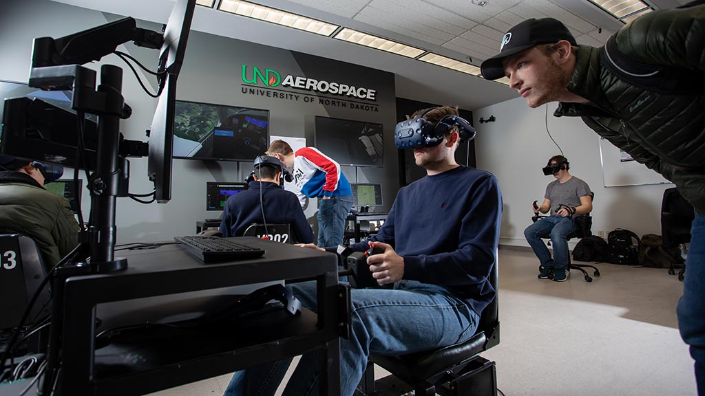 student works on flight simulator