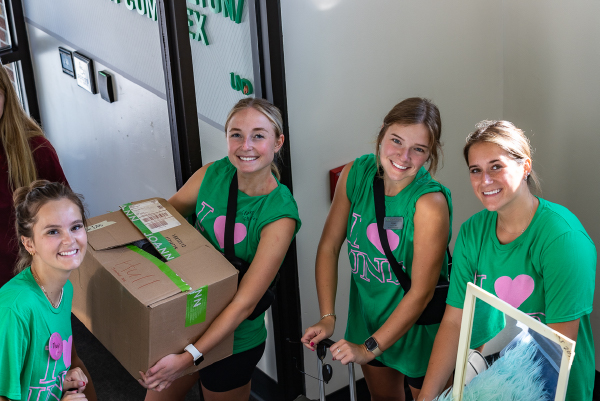 volunteers moving in boxes