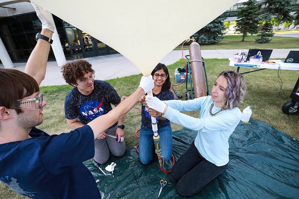 students work on weather balloon