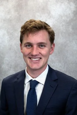 Daniel Masterson in navy suit