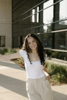 Elisa Foell in white top on sunny day