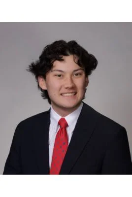 Jackson Minor in black suit