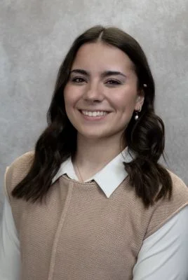 Megan Lee photo in brown sweater