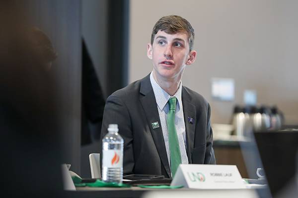 student leader talking during meeting