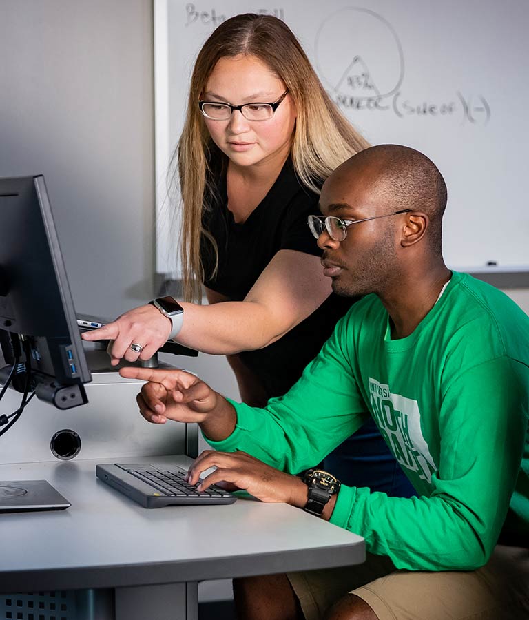 Students working together at a computer
